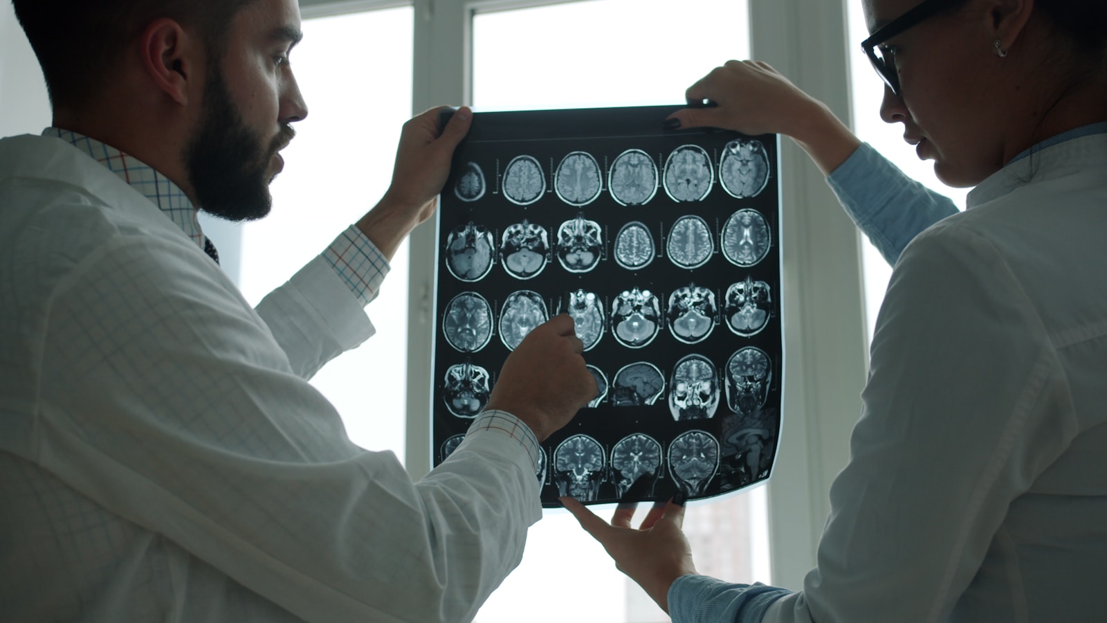 Clinicians reviewing a brain MRI scan together